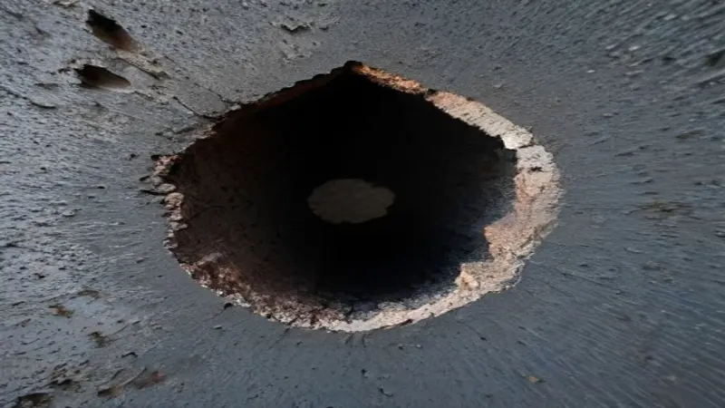 A cross-section of a wall cavity revealing thin R30 insulation material.
