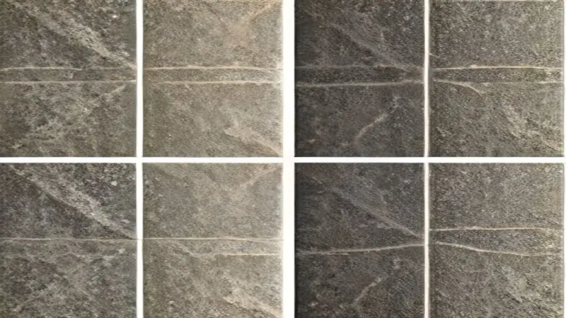 Close-up of two distinct tile samples side-by-side, showcasing different textures and patterns.
