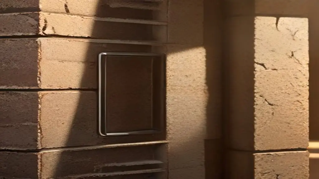 Close-up of a structural brick veneer wall showing metal masonry anchors and mortar joints