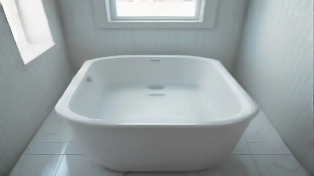 Water pooling on the subfloor beneath an installed white ceramic bathtub